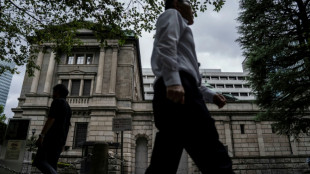 Most Asian stocks track Wall St rally, yen drops after BoJ rate hike